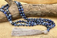 Collier mala bleu pompon gris 